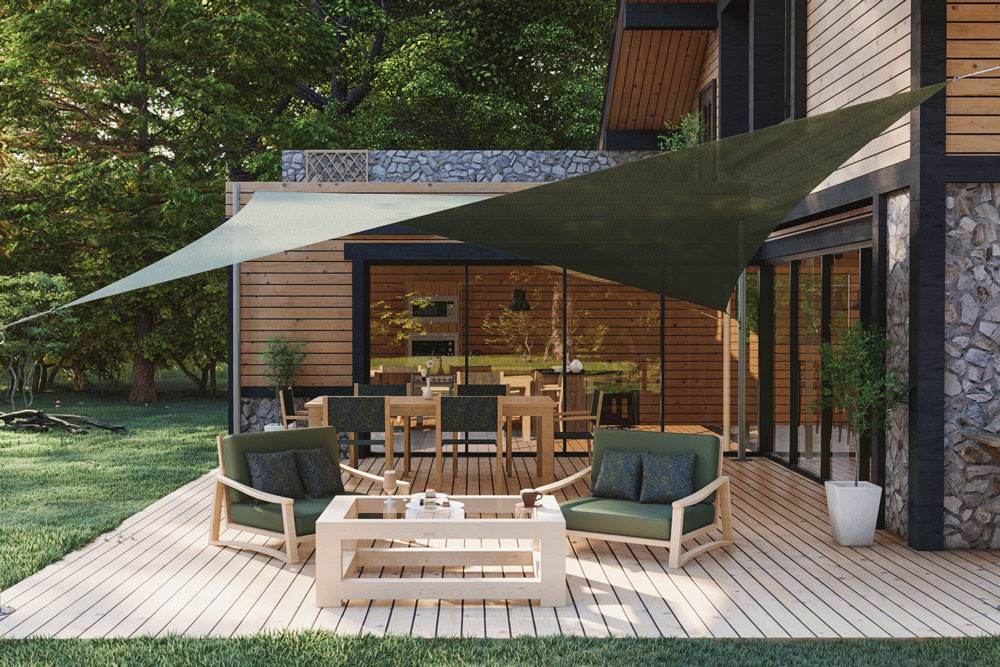 Voile d’ombrage TWIST verte tendue au-dessus d’un salon de jardin sur une terrasse en bois